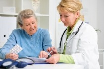 Doctor meeting with elderly patient